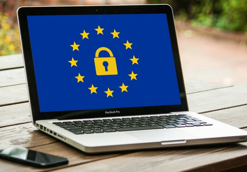 Laptop on table showing GDPR logo