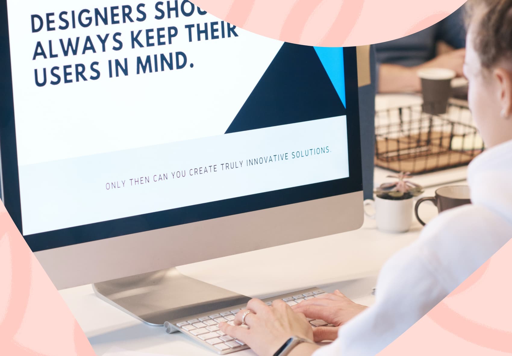 Woman sitting in front of a Mac computer