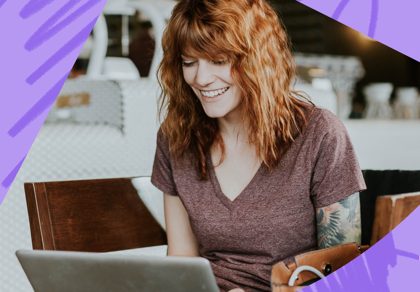 Smiling woman sitting in front of a laptop