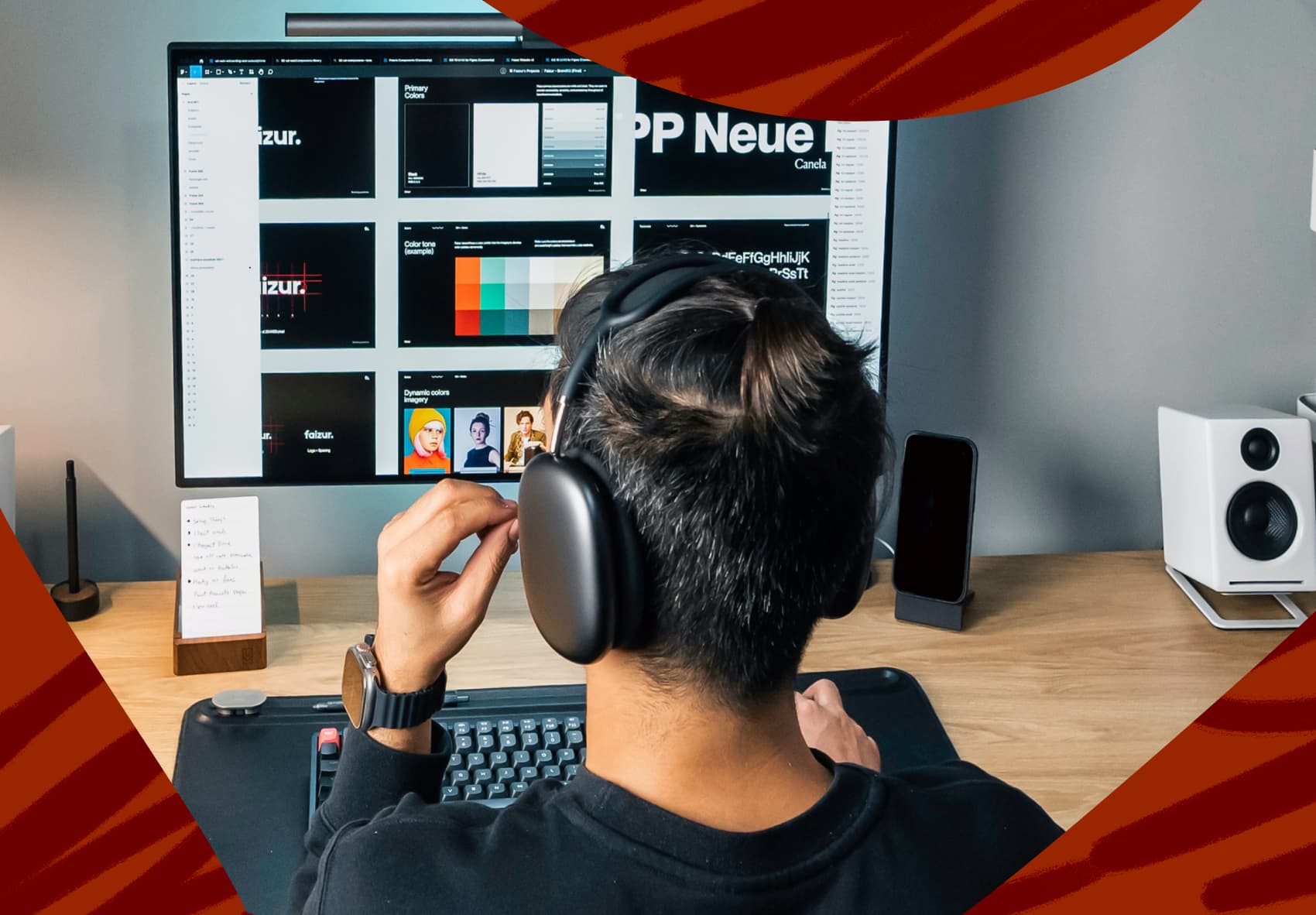 Man with headphones on looking at computer screen
