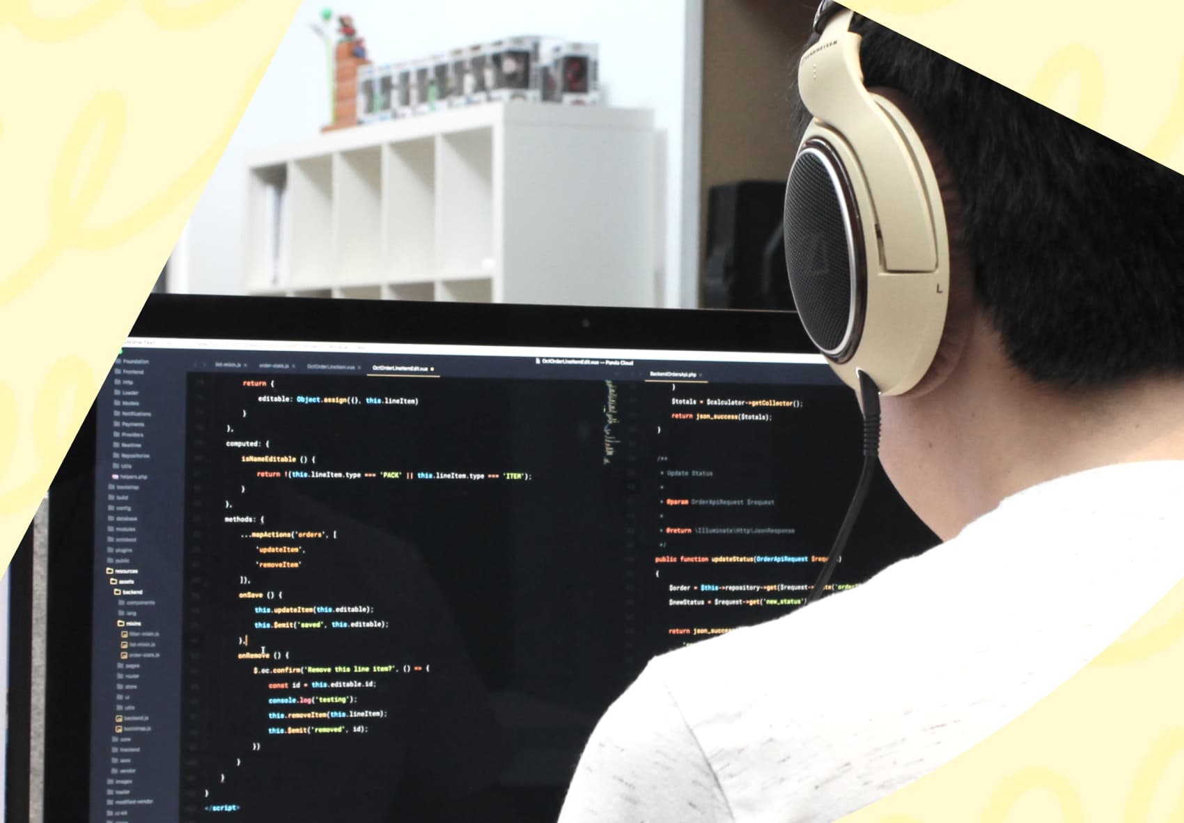Man with headphones on sitting in front of computer