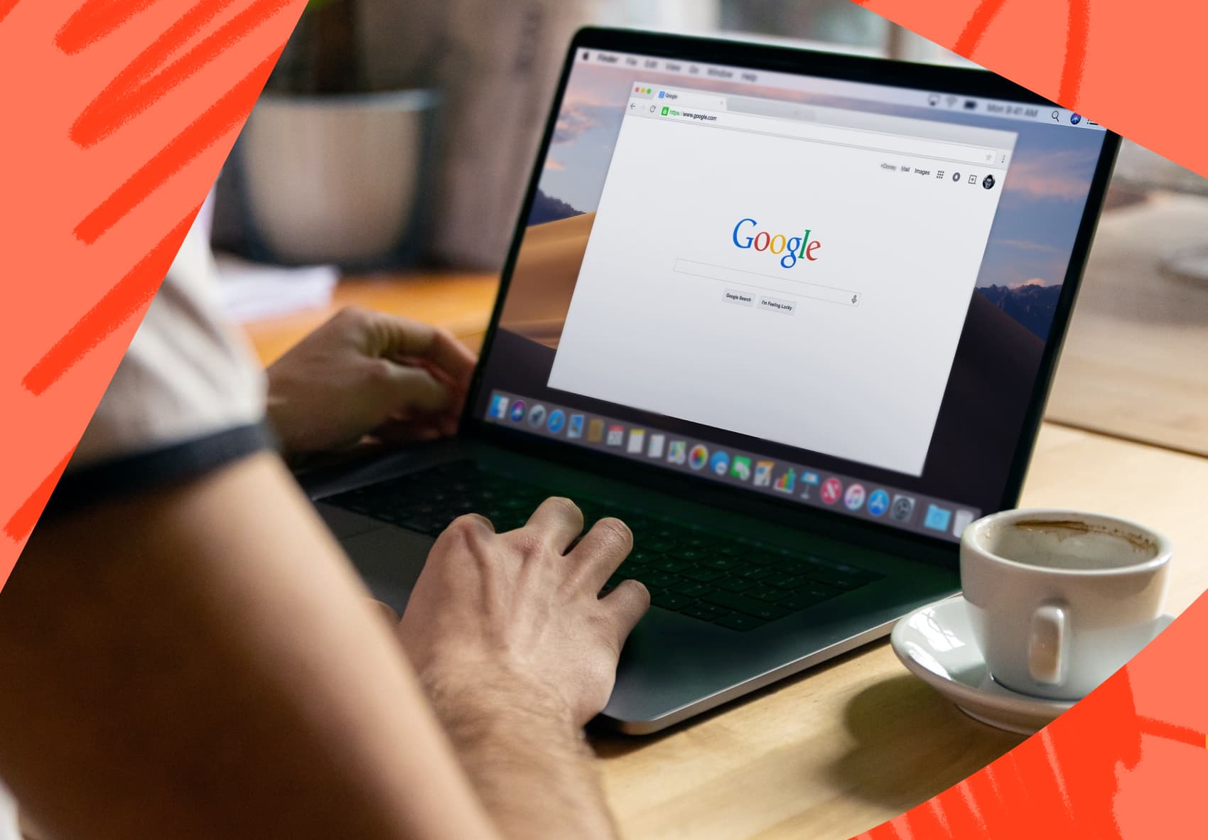 Two hands typing on the keyboard of a laptop. The screen is on the Google search homepage