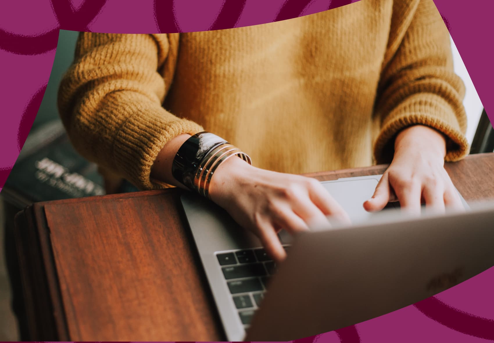 Two hands typing on laptop