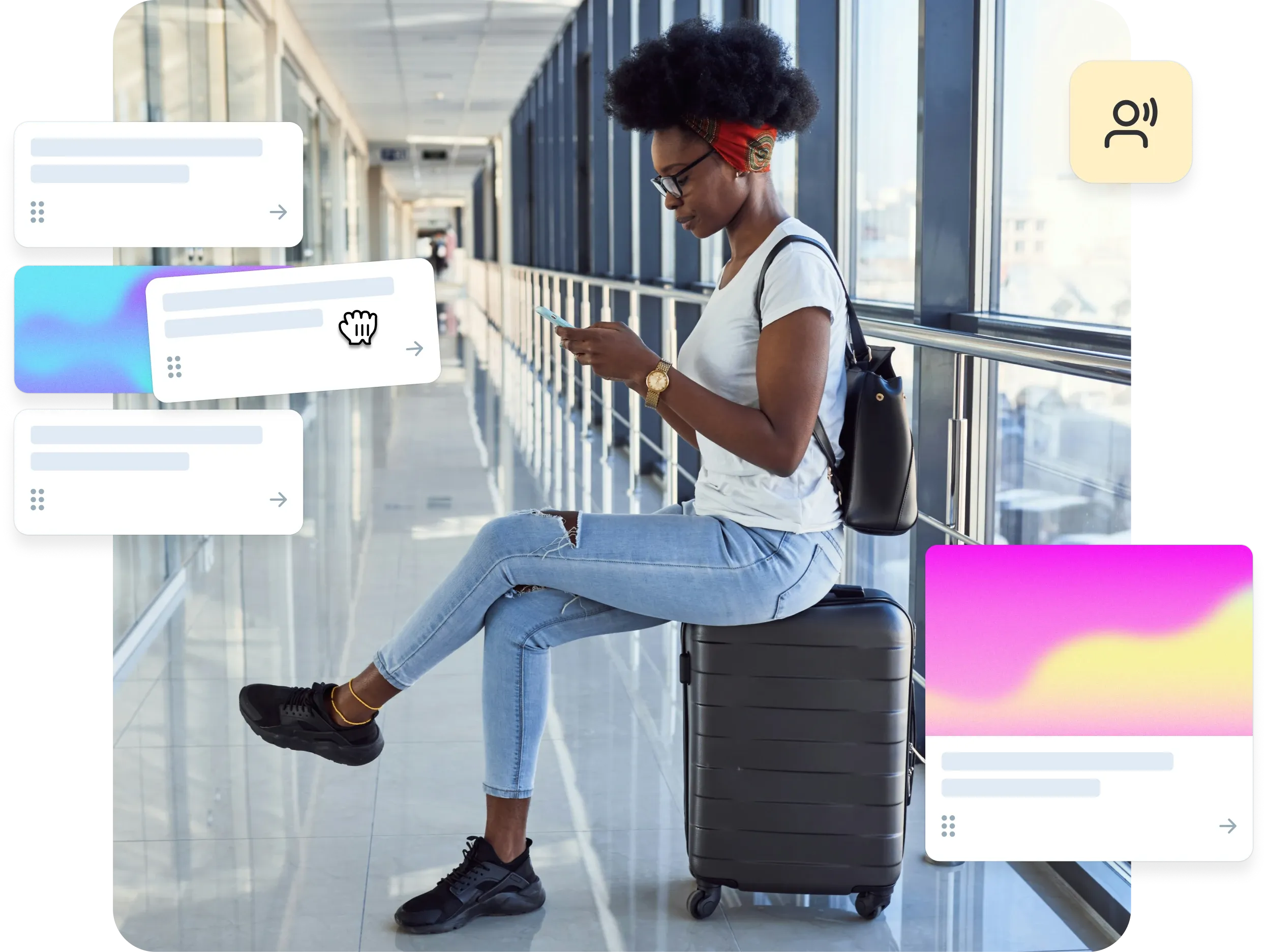 Woman sitting on suitcase in airport hallway, using a travel app.